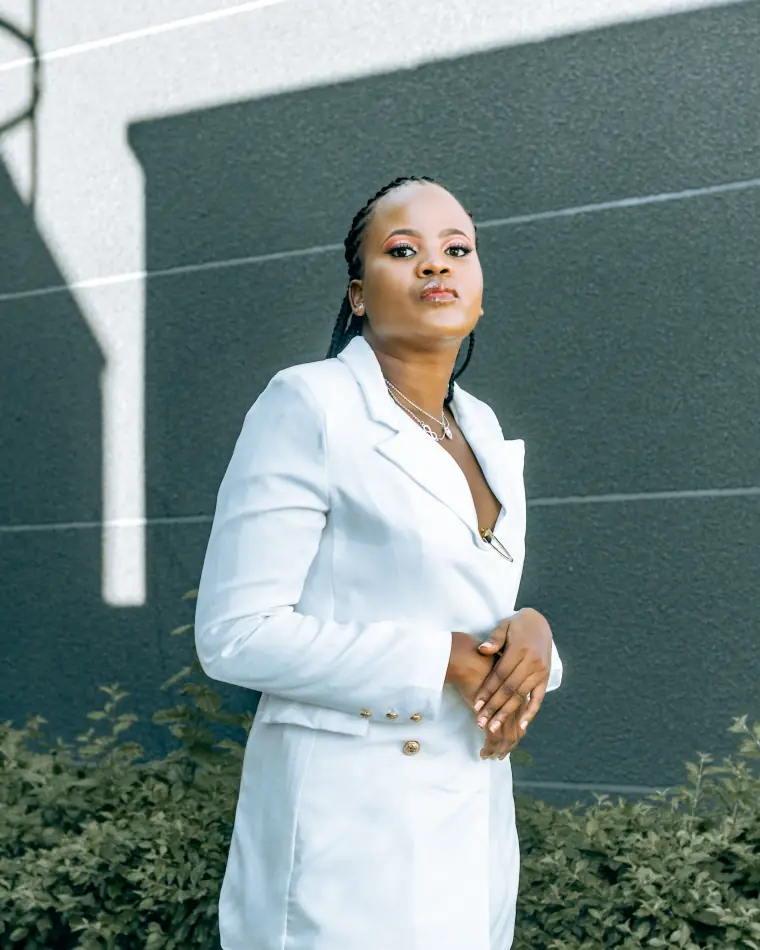 A director standing outside her office building